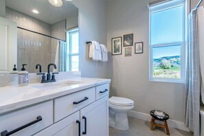 Shower, hair dryer, towels, soap