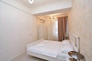 Deluxe Apartment, City View | Blackout drapes, iron/ironing board, free WiFi