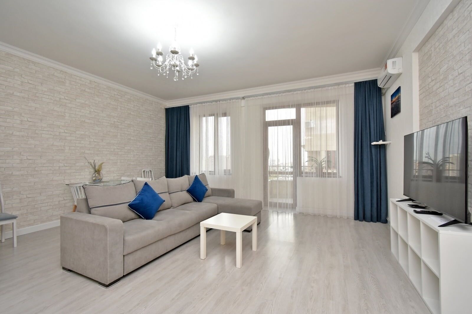 Deluxe Apartment, City View | Living area | 50-inch flat-screen TV with cable channels