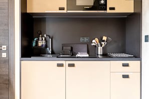 Fridge, microwave, stovetop, coffee/tea maker