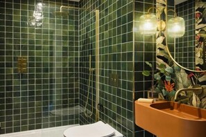 Shower, hair dryer, towels, toilet paper