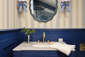 Shower, hair dryer, towels, toilet paper