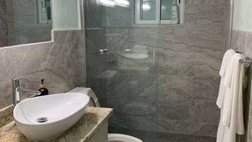 Shower, hair dryer, towels, soap