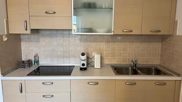 Fridge, microwave, stovetop, coffee/tea maker