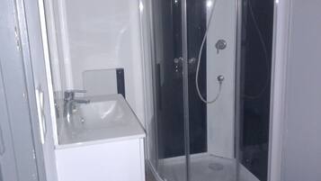 Shower, hair dryer, towels, toilet paper