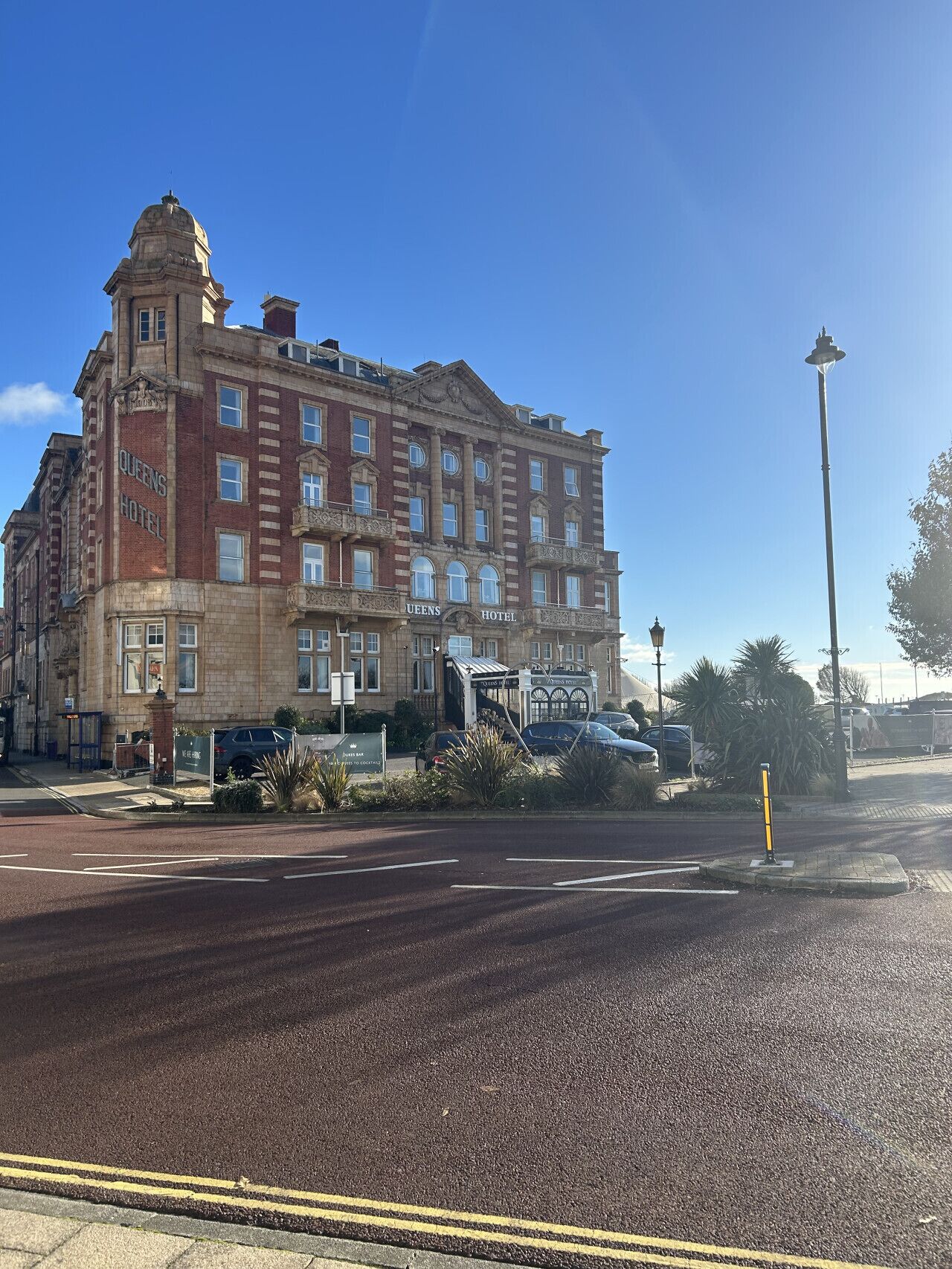 A large, historic hotel with a prominent corner entrance, multiple floors, and a classic architectural style.