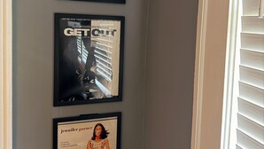 Three framed movie posters on a wall. - ATL Movie House, Theater Room, Sleeps9, Near Downtown (Atlanta)