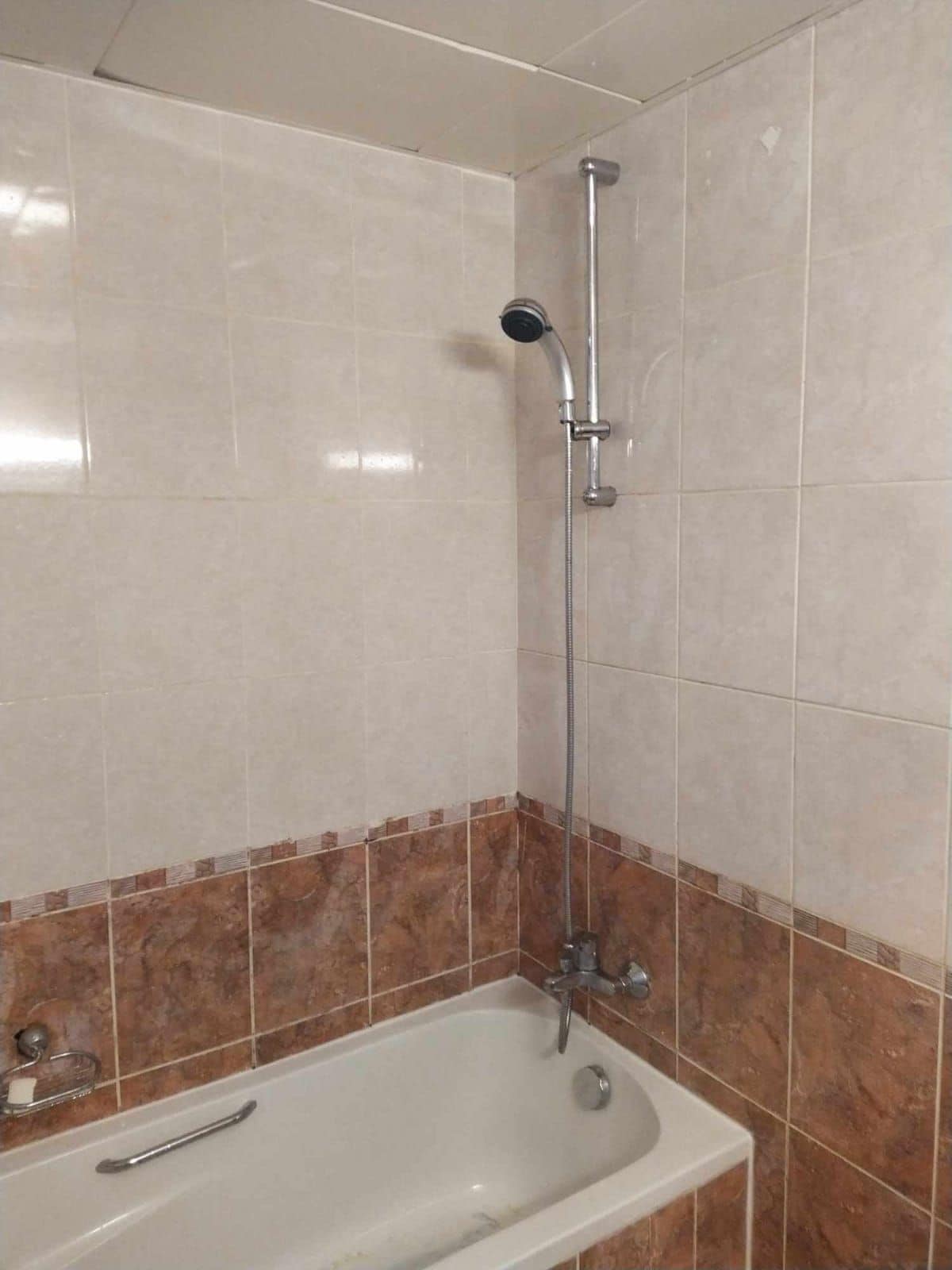 A bathroom with a bathtub, a shower, and a toilet.