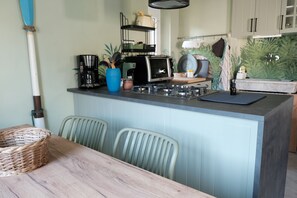 Fridge, electric kettle, cookware/dishes/utensils