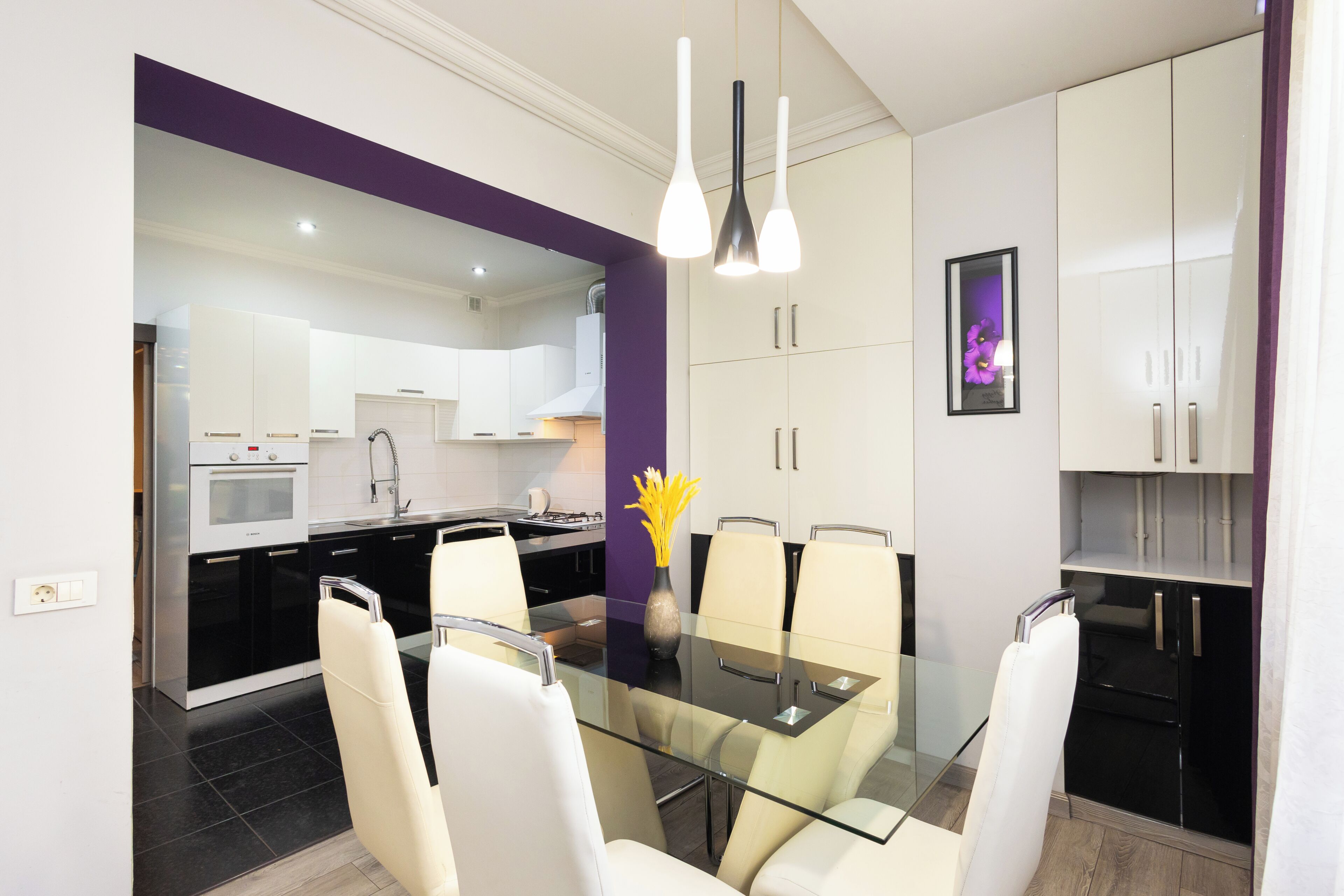 A modern kitchen with a dining area.