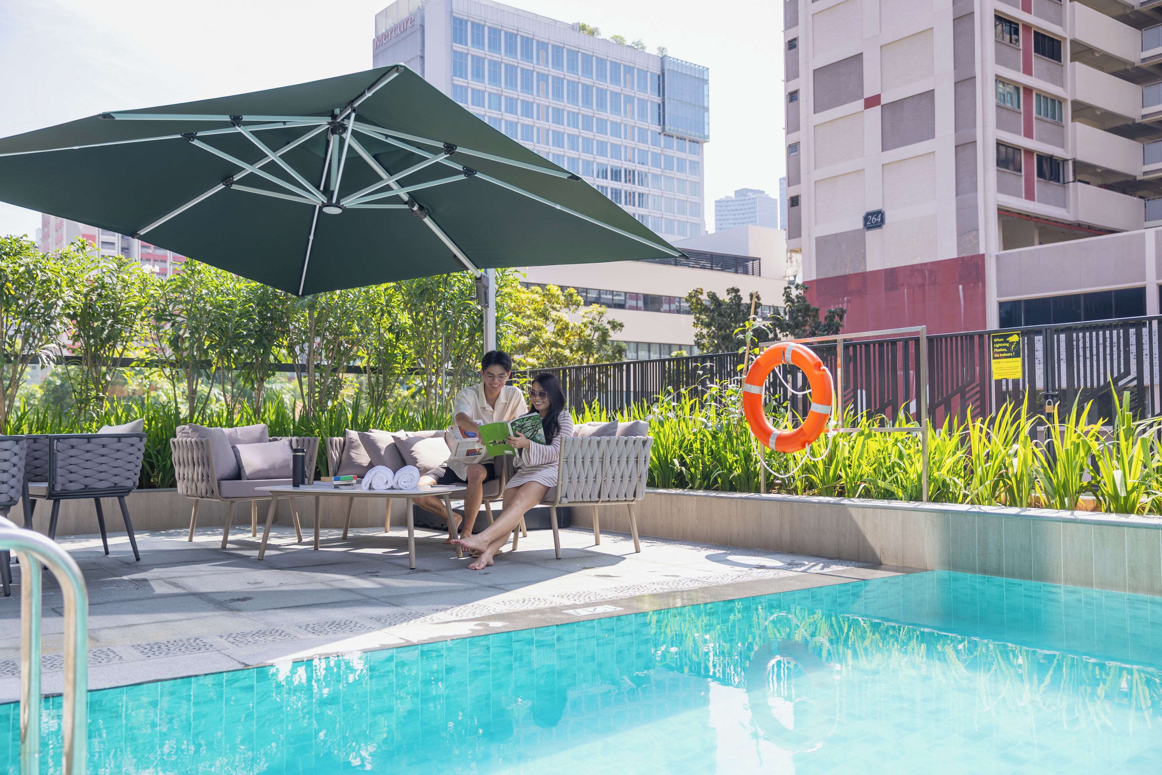 Outdoor pool, open 7:00 AM to 9:00 PM, pool loungers