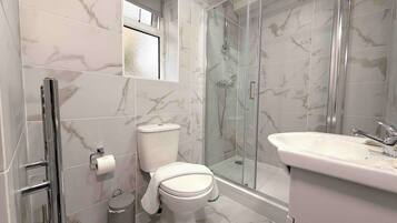 Shower, hair dryer, towels, soap