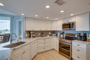 Microwave, oven, stovetop, dishwasher - Oceanfront Escape - Peaceful 3BR Beach Apartment on North Hutchinson Island (Fort Pierce)