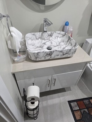 Shower, towels, soap, toilet paper