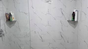 Shower, towels, soap, toilet paper
