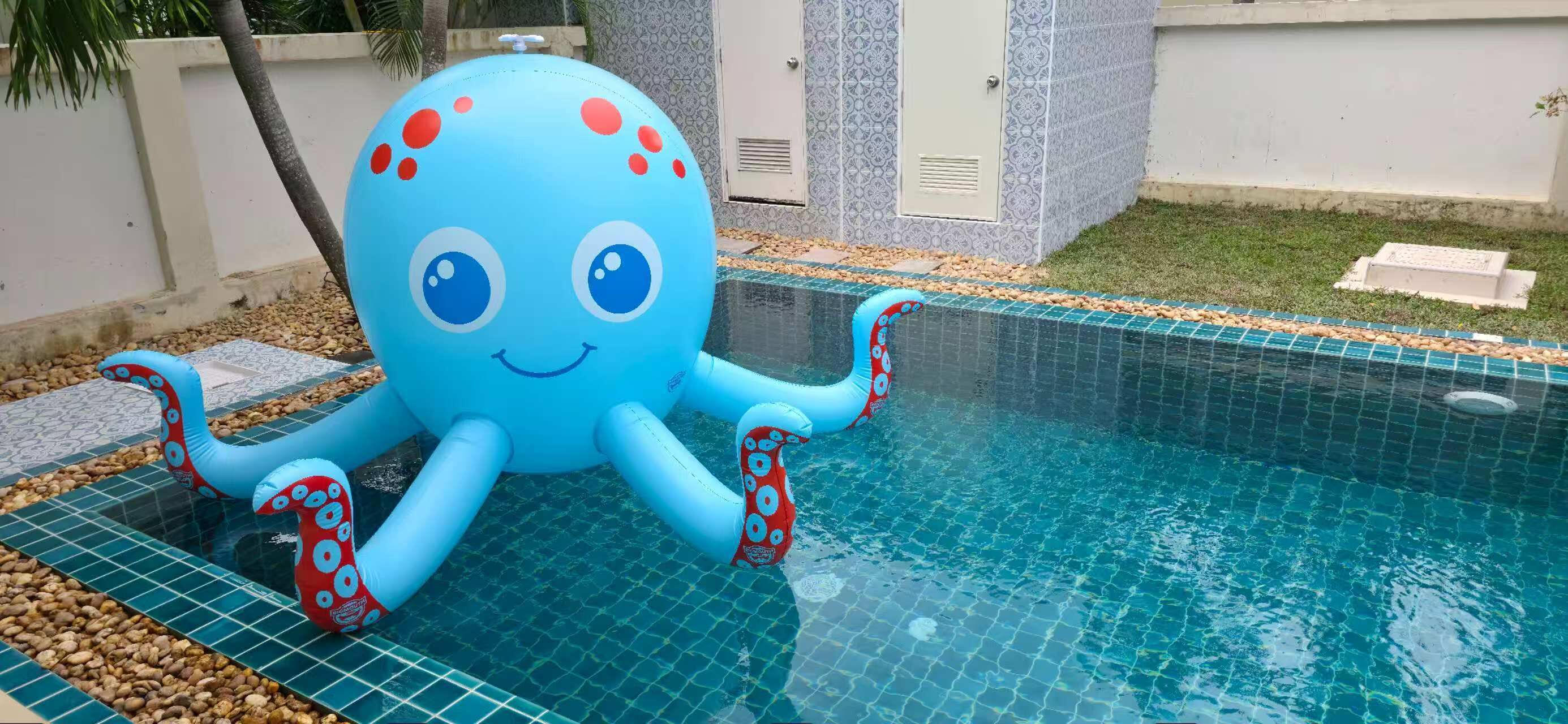 A blue octopus-shaped inflatable toy in a swimming pool.