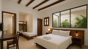 A hotel room with a large bed, a desk with a chair, a small bunk bed, and a wardrobe. - Pousada Vila Lençóis e Sport (Barreirinhas)