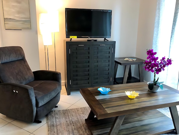2 Bedrooms & 2 Bathrooms Coral Way Apartment | Living area | 42-inch LED TV with digital channels