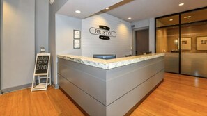 A reception desk with a sign reading "The Bristol on Union." - Landing Apartments Memphis near UTHSC (Memphis)