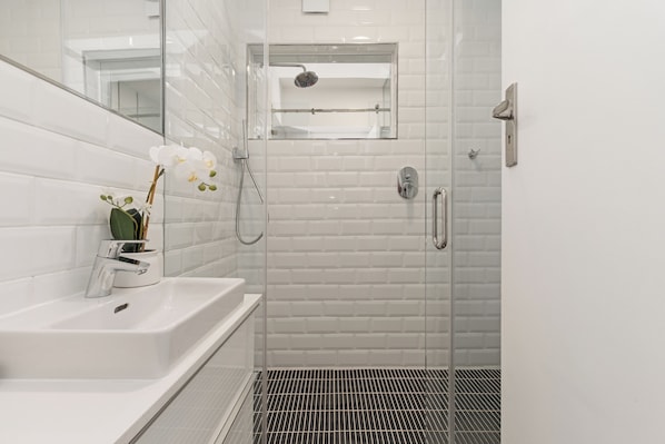 Shower, hair dryer, towels, soap