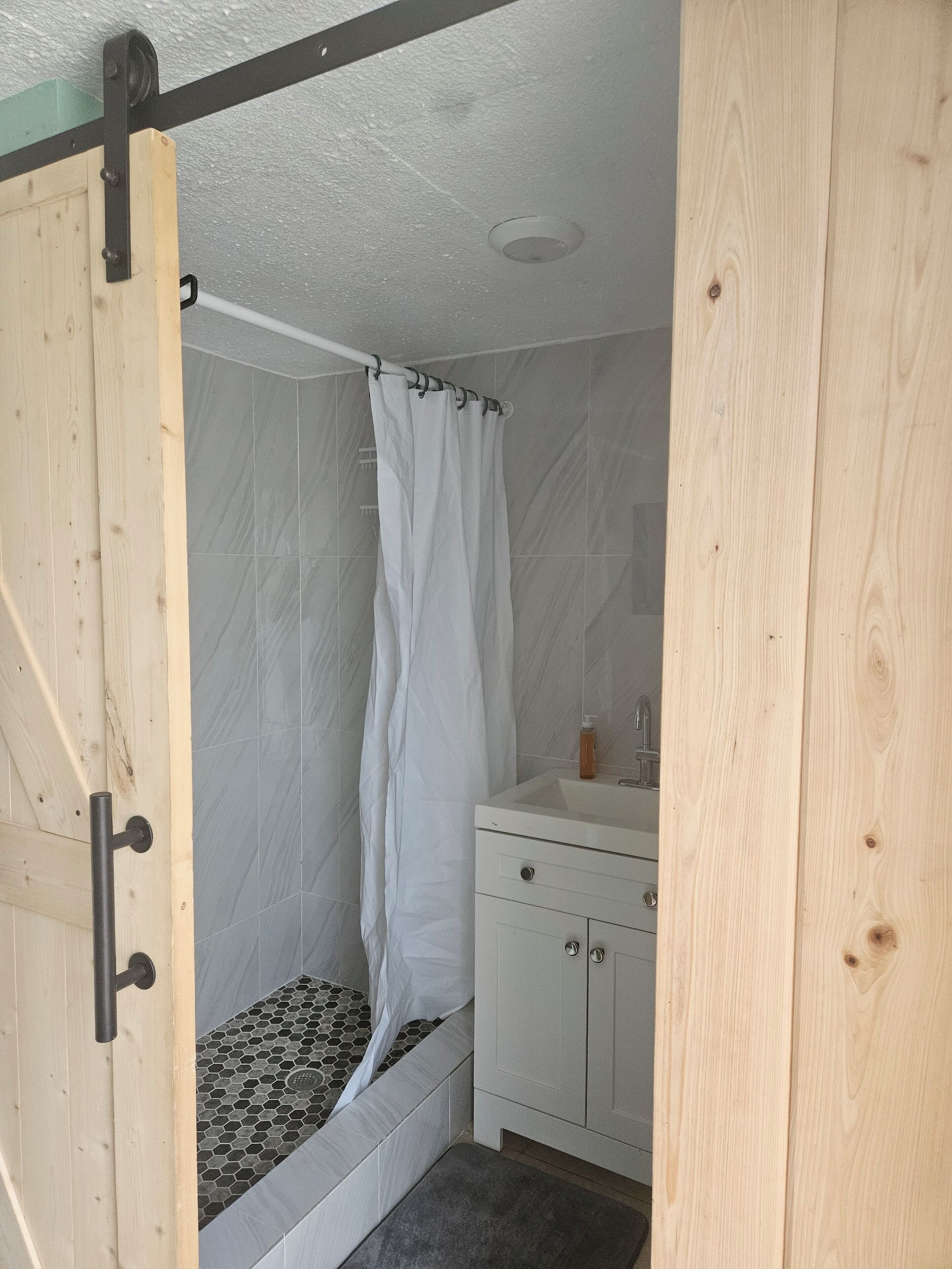 Shower, towels, soap, toilet paper