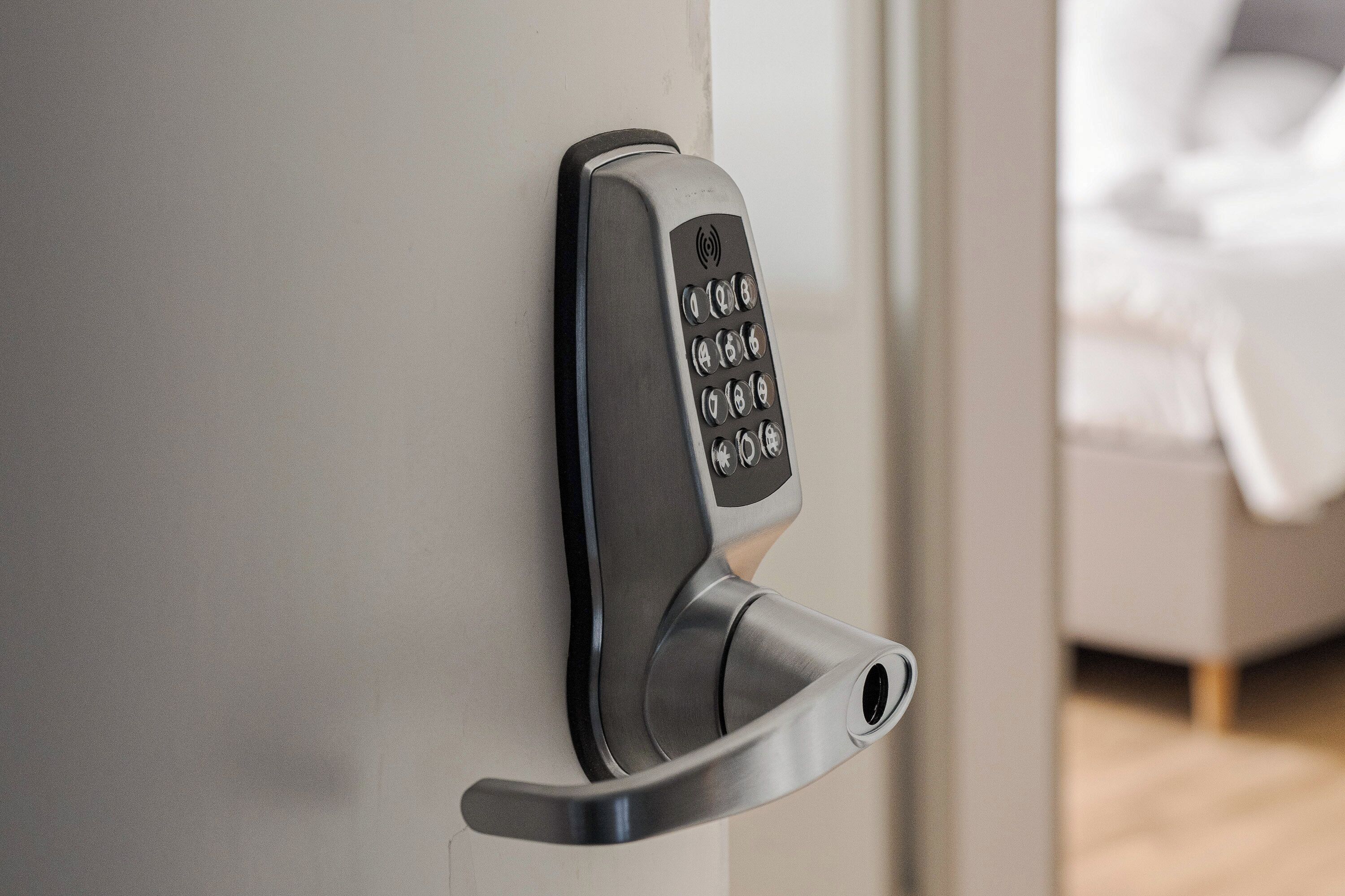 A modern door with a keypad lock.