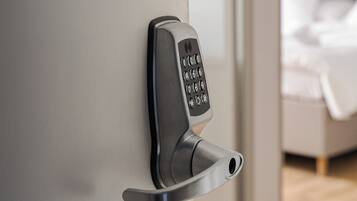 A modern door with a keypad lock.