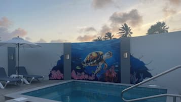 Outdoor pool, open 7:00 AM to 9:00 PM, pool umbrellas, pool loungers