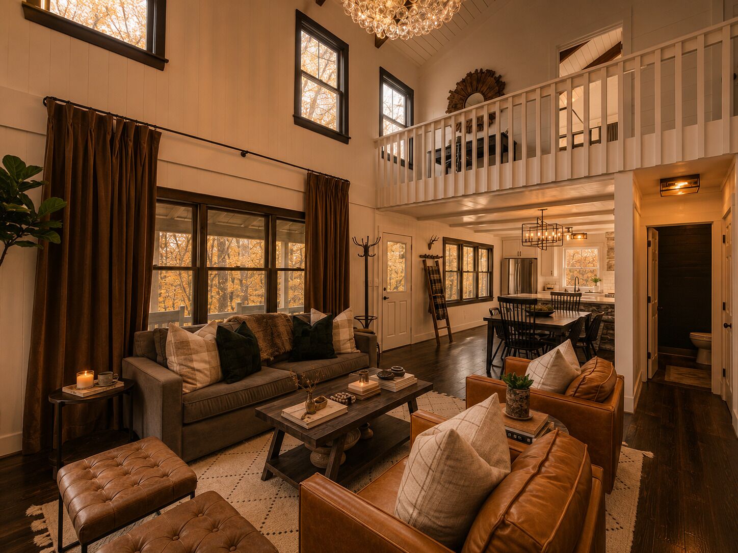 A spacious living room with a high ceiling, a dining area, and a kitchen with a stone backsplash.
