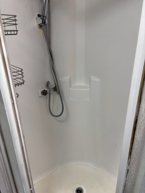 Shower, towels, soap, toilet paper