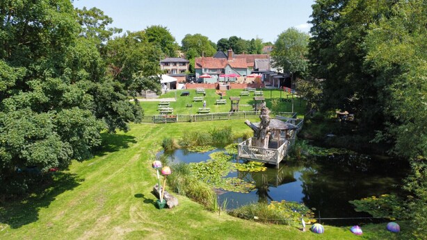 A park with a pond, picnic tables, and a gazebo. - 2 Cosy Cabin at 15th C Pub (Wendens Ambo)