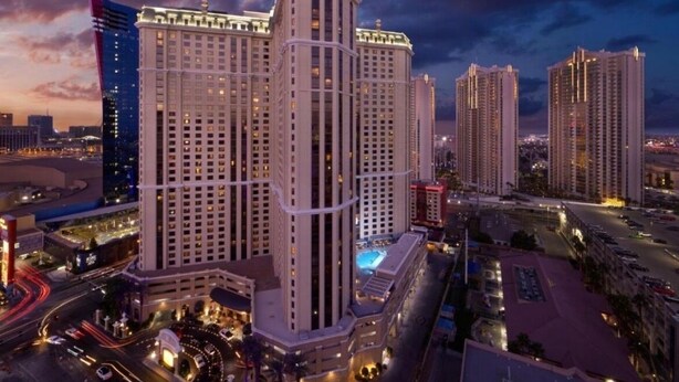 A high-rise hotel with multiple floors, a prominent entrance, and a pool area. - Marriott Grand Chateau Charming 2-bedroom Villa-Las Vegas. (Las Vegas)