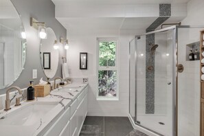 Shower, jetted tub, hair dryer, towels