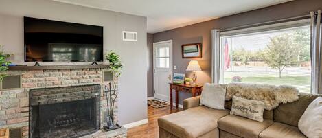 TV, fireplace, books