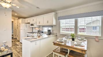 Fridge, microwave, electric kettle, dining table