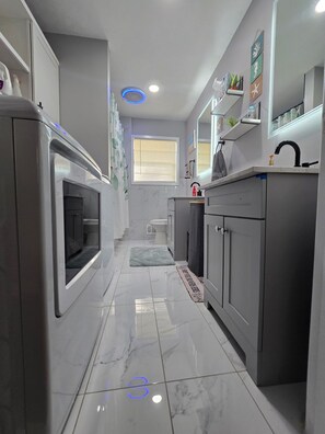 Hair dryer, towels, soap, toilet paper