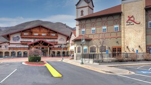 A building with a prominent tower, a sign for 'Steak & Chop Haus,' and a parking lot with marked handicapped spaces. - 206 | Midway Stay | 2Q Suite Near Park City + Pool (Midway)