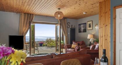 Escape to this charming 2 bedroom dog friendly house with amazing sea views