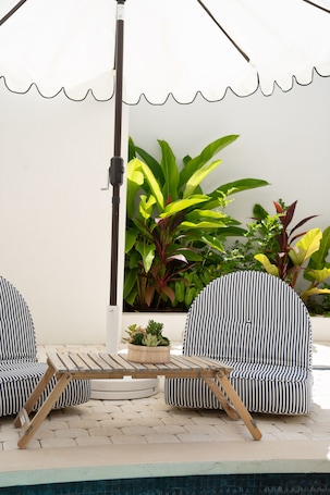 Outdoor pool, pool umbrellas, sun loungers
