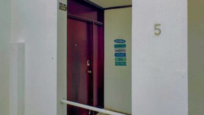 A door with a sign indicating room numbers 5 and 6. - Endless Ocean Views 4 bedroom suites, Private Pool, minutes from downtown Coco (Coco)