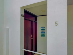 A door with a sign indicating room numbers 5 and 6.