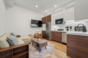 Apartment, 1 Bedroom, City View | Living area | 60-inch Smart TV with digital channels, iPod dock - Symple Live (Boston)