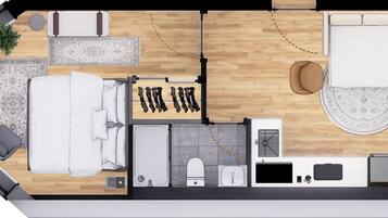Indeling van een hotelkamer met een bed, twee zithoeken, een kleine badkamer en een kitchenette.
