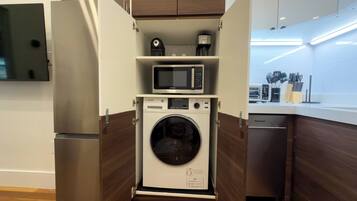 Suite (Luxury 1BR w/ King Bed & City Views) | Laundry