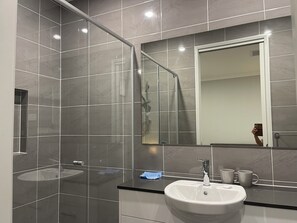Shower, hair dryer, towels, soap