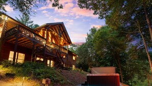A wooden cabin with a balcony, surrounded by trees. - The Hidden Still~Blue Ridge Speakeasy Lakehouse~SLEEPS 22 (Cherry Log)