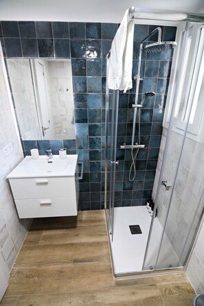 Shower, hair dryer, towels, soap