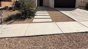 A modern house with a driveway leading to a garage. - Modern 4BR, 3 King Beds + Full Near Red Hawk (Las Cruces)