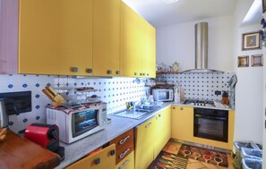 Fridge, stovetop, dishwasher, coffee/tea maker