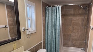 A bathroom with a sink, toilet, and shower area. - Short term rentals and corporate housing.  Up to 25% discounts for longer stays (Winnemucca)